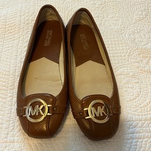 Size 9 B Michael Kors flats in medium brown. Worn once or twice.